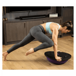 Strength Training Equipment- (300*300)- Woman using the Purple Bosu Ball (inverted) performing mountain climbers in an indoor setting