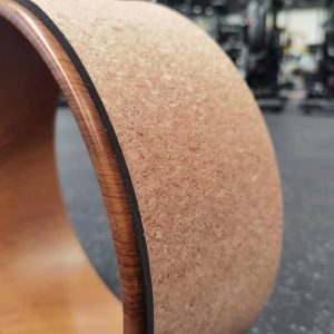 Yoga Product- (300*300)- Close profile view of the Cork Yoga Wheel shown in gym setting