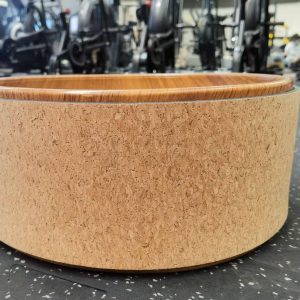 Yoga Product- (300*300)- Cork Yoga Wheel in horizontal position shown in gym