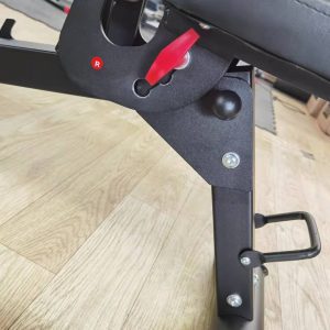 Strength Training Equipment-(300*300)- View of the height adjustment lever (red) of the Adjustable Bench (Flat/Incline/Decline) in gym setting