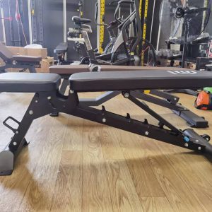Strength Training Equipment-(300*300)- Side view of the Flat/Incline/Decline weight bench in flat position in gym setting