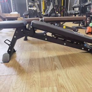 Strength Training Equipment-(300*300)- Side view of the Flat/Incline/Decline weight bench in decline position in gym setting