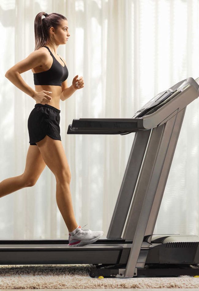 Girl running on treadmill