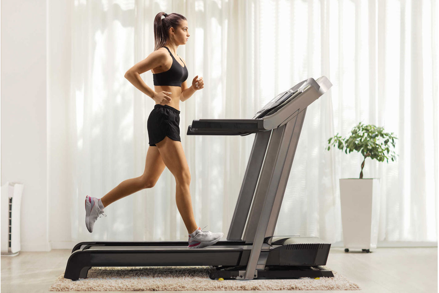 Girl running on treadmill