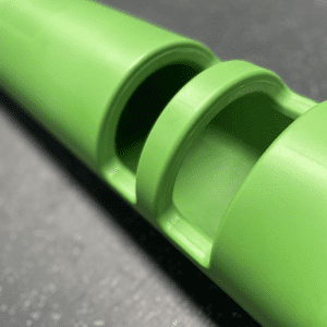 Gym Equipment- (300*300)- Close view of the handle area of the 10KG Green Colour VIPR Natural Rubber Weight Fitness Barrel on gym floor