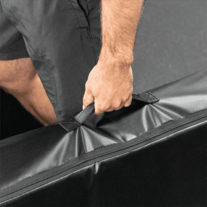 Gym Accessories- (300*300)- Man vertically holding the Shock Mat for Barbell Dropping with carry handle