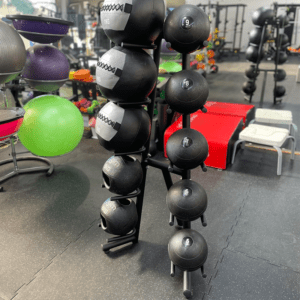 Medicine ball stand with balls in gym